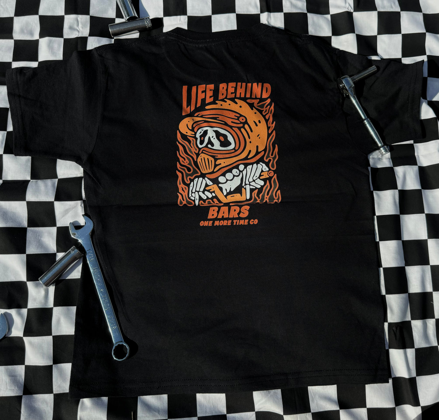 BEHIND BARS TEE